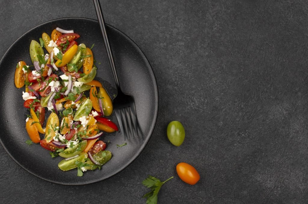 top-view-tomato-mix-salad-with-feta-cheese-rucola-copy-space
